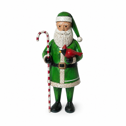 Green Santa Claus figurine holding a candy cane and cardinal bird on a white background