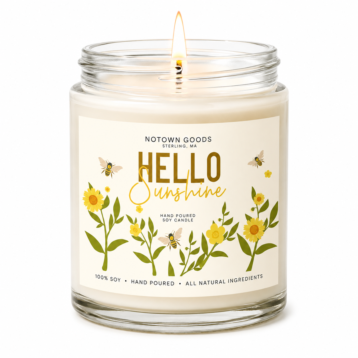 Clear jar candle with white wax and a decorative label on a white background.