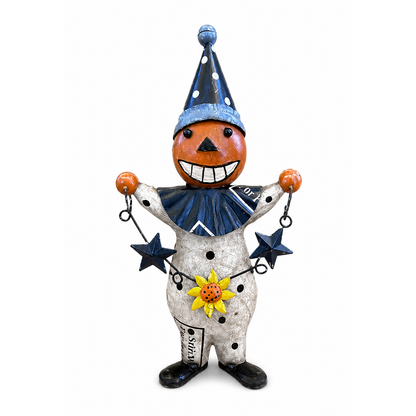 Decorative figure with a pumpkin head, blue hat, and star accents on a white background