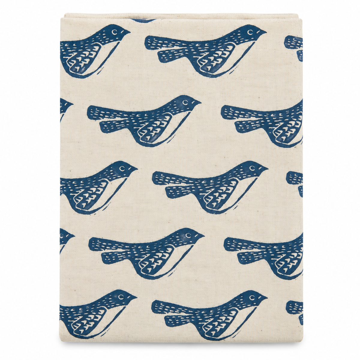 A cream colored tea towel with birds design printed in black on a white background.