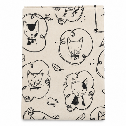 A cream colored tea towel with sketched cat design printed in black on a white background.