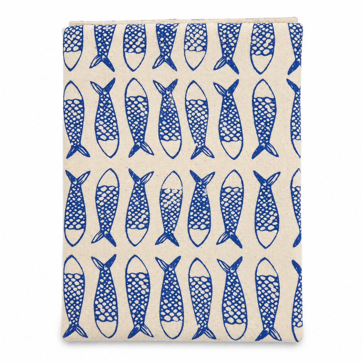 A cream colored tea towel with fish design printed in blue on a white background.