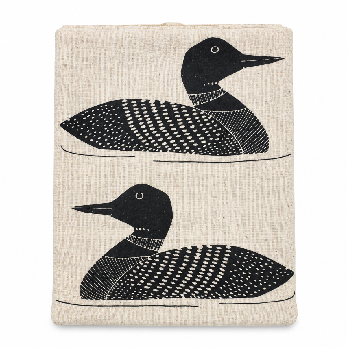 A cream colored tea towel with black loon design on a white background.