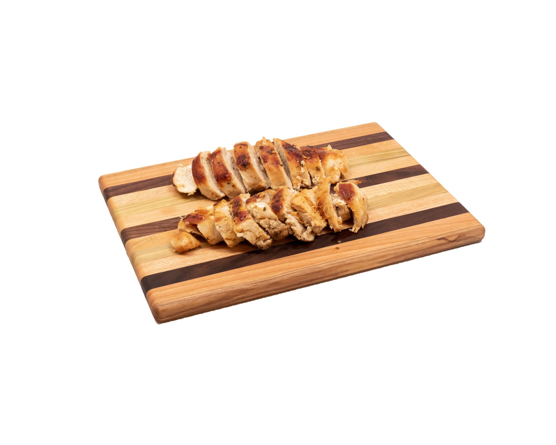 Sliced chicken on a wooden cutting board with a striped pattern