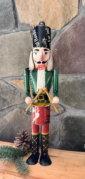 Nutcracker figurine with a stone wall background
