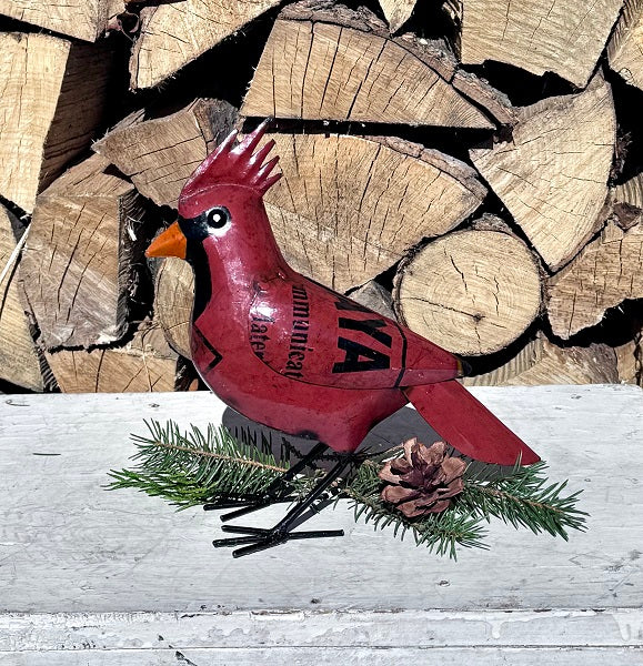 Red cardinal bird  figurine on a wooden background