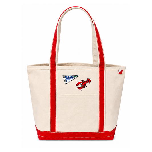 Beige tote bag with red handles and accents, featuring a lobster design and 'Maine' text on a white background.