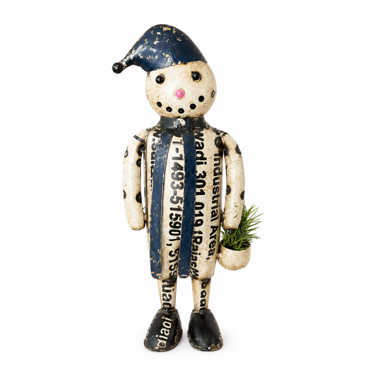 Decorative figure made from recycled materials with a blue hat and black shoes on a white background