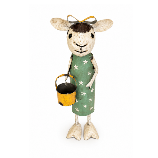 Decorative figure of a sheep with a green dress holding a yellow bucket on a white background