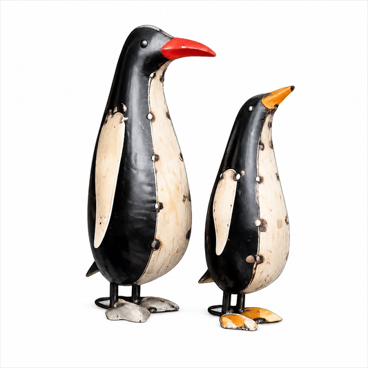 Two penguin figurines on a white background.