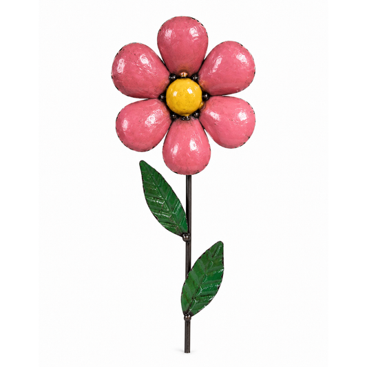 Pink daisy garden stake with yellow center and green stem and leaves on a white background.