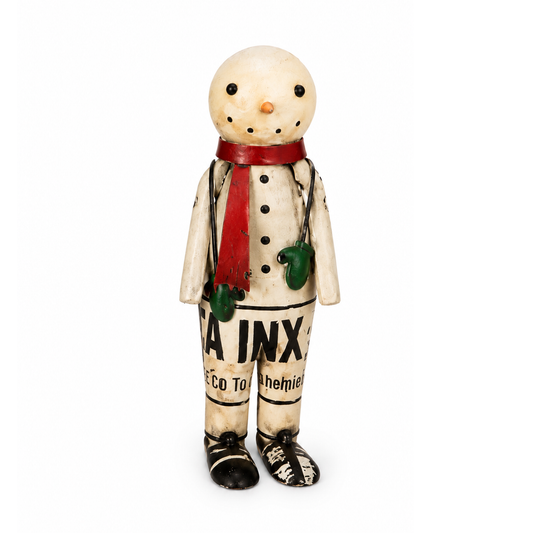  Snowman figurine with a red scarf and green mittens on a white background.