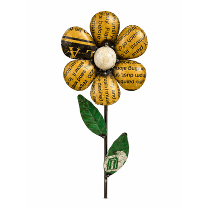 Yellow daisy garden stake with white center and green leaves and stem on a white background.