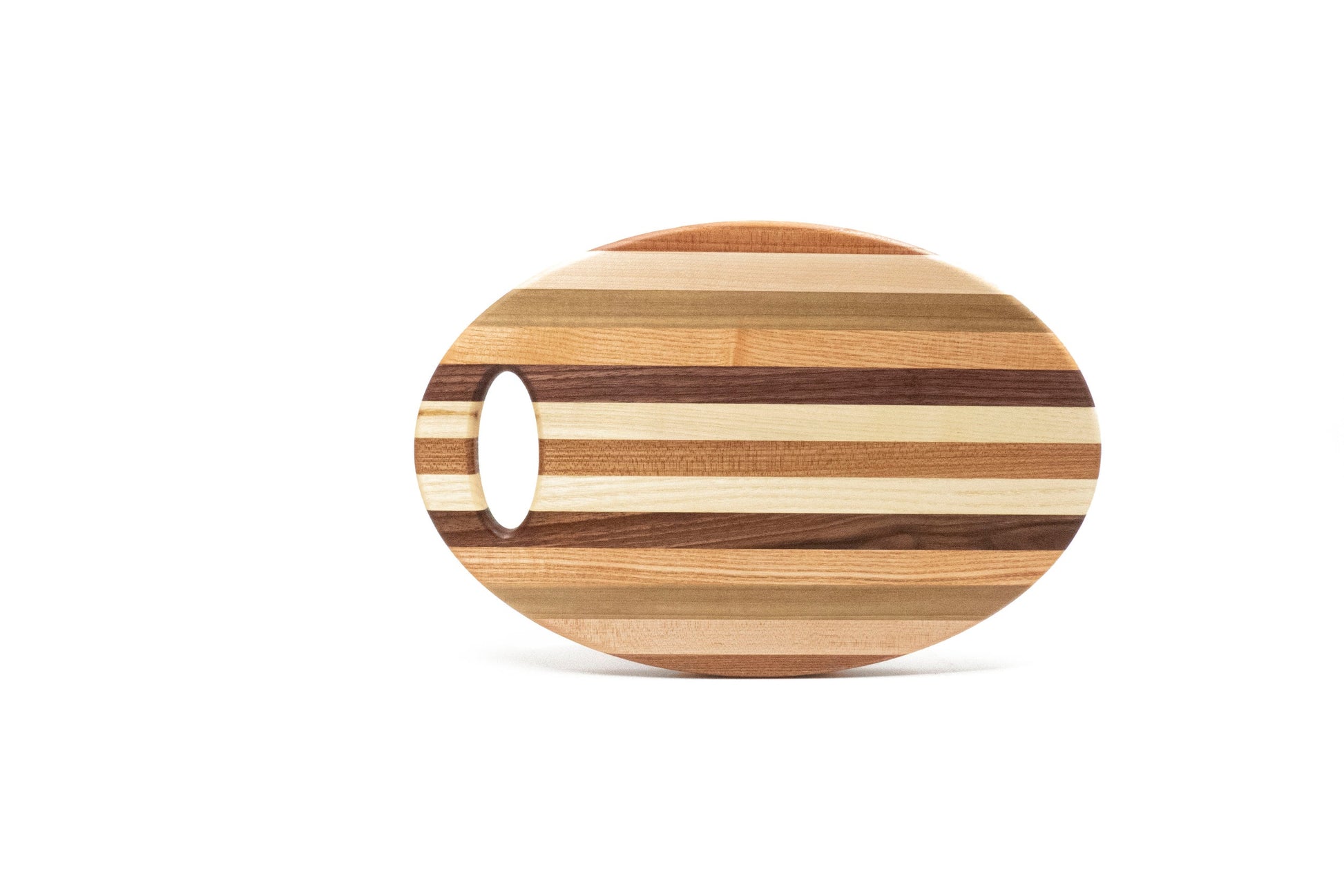 Oval wooden cutting board with a handle on a white background
