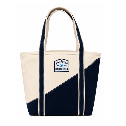 Navy and beige tote bag with 'Entering Nantucket' logo on a white background