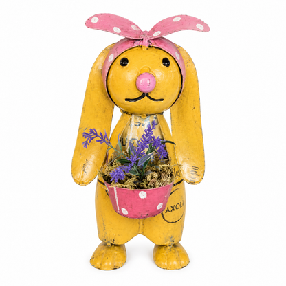 Metal Bunny sculpture with pink ribbon headband and holding a pink bucket filled with flowers on a white background.