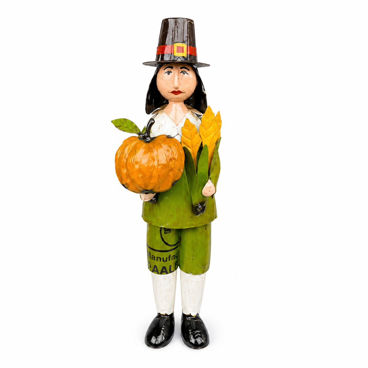 Figurine of a person in pilgrim attire holding a pumpkin and corn stalk on a white background