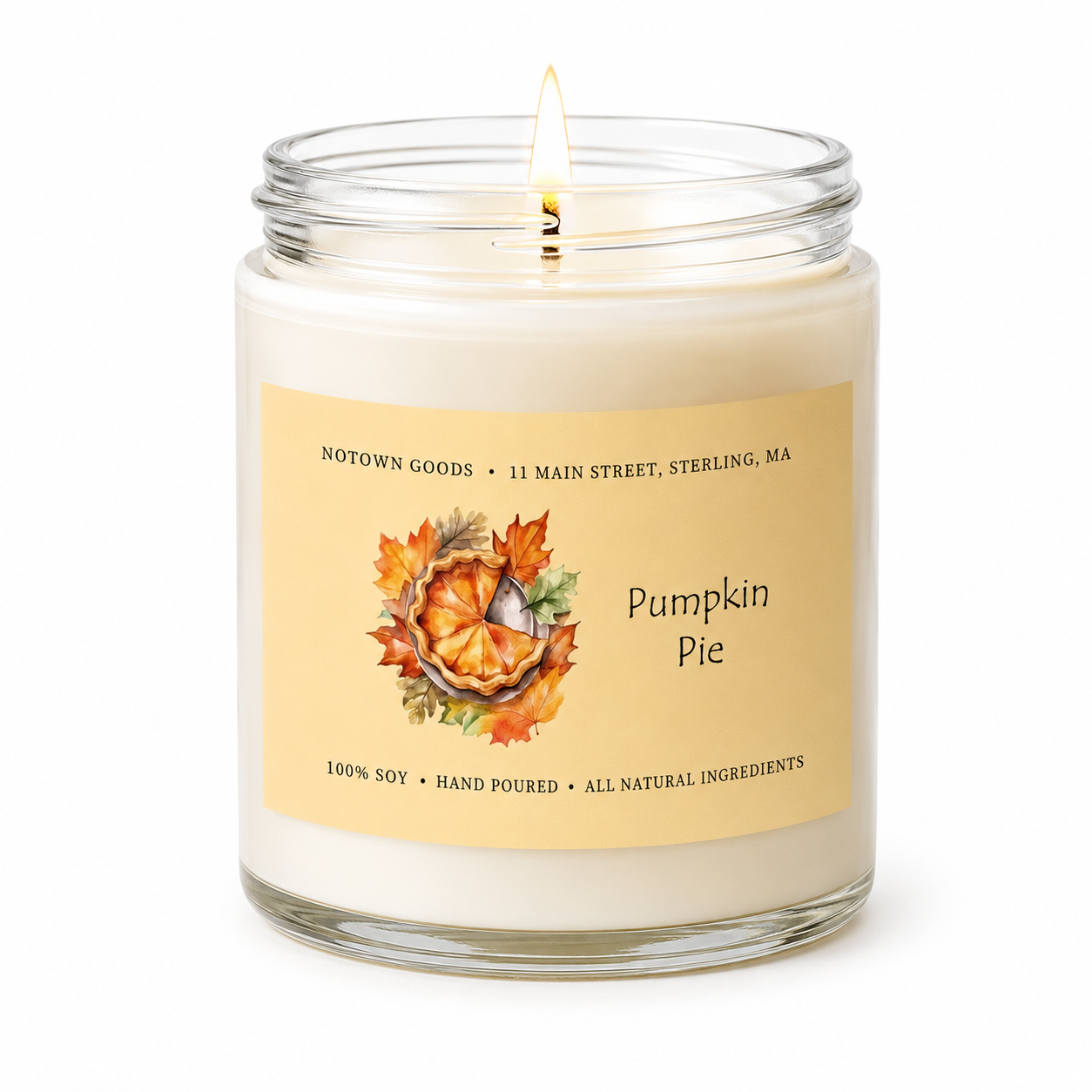 Clear jar candle with white wax and a decorative label on a white background.