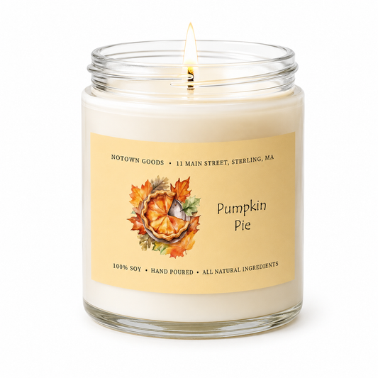 Clear jar candle with white wax and a decorative label on a white background.