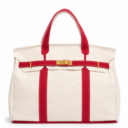 White tote bag with red straps and trim on a white background