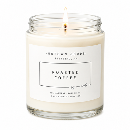 Clear jar candle with white wax and a decorative label on a white background.