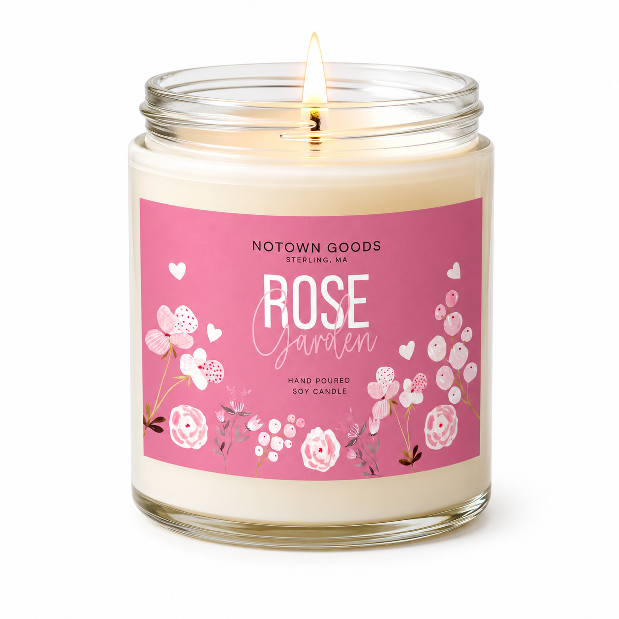 Clear jar candle with white wax and a decorative label on a white background.