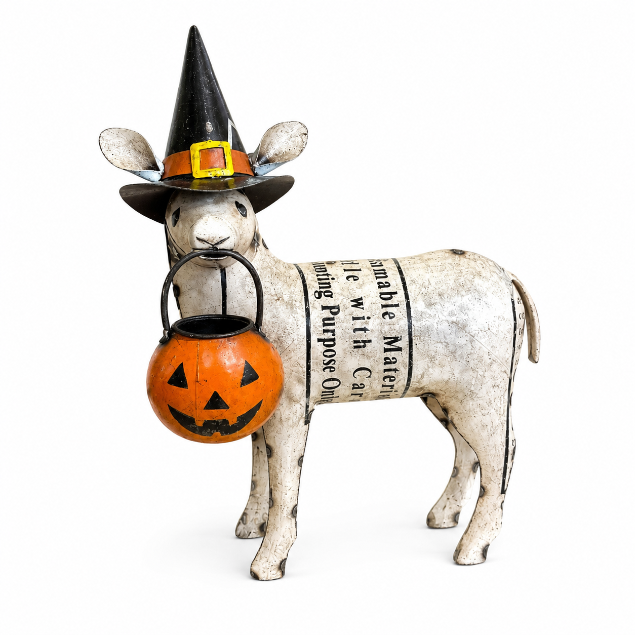 Decorative sheep figure wearing a witch hat and holding a pumpkin lantern on a white background