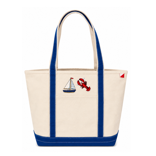 Tote bag with sailboat and lobster design on a white background
