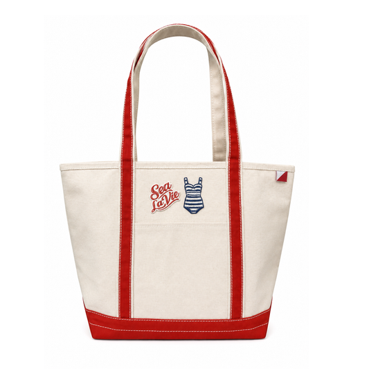White tote bag with red accents and 'Sea La Vie' logo on a white background