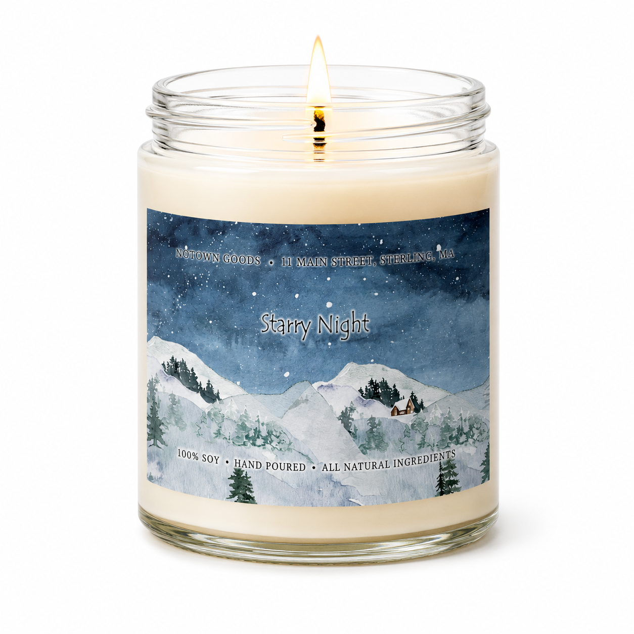 Clear jar candle with white wax and a decorative label on a white background.