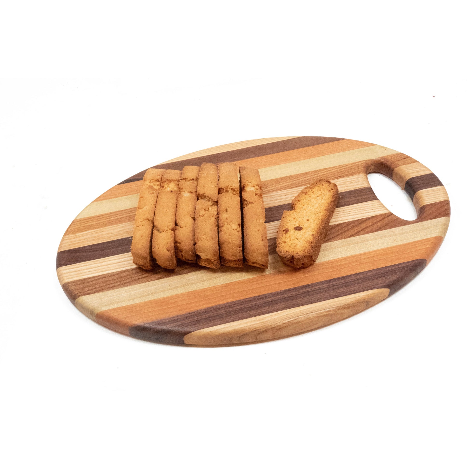 Wooden cutting board with sliced biscotti on a white background