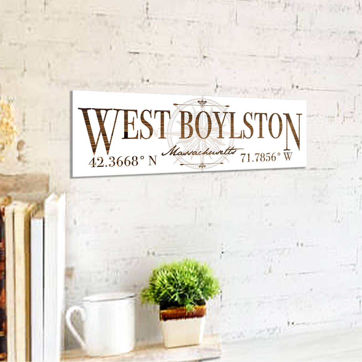 Decorative sign with 'West Boylston' text on a white brick wall background