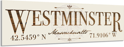 Decorative sign with 'Westminster, Massachusetts' text and coordinates on a beige background