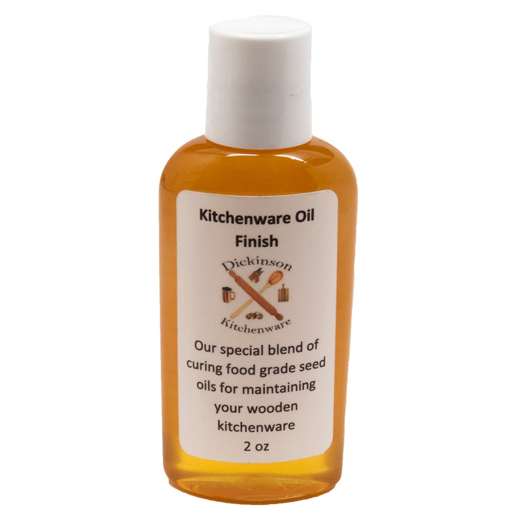 Bottle of Kitchenware Oil Finish with a white label on a white background.
