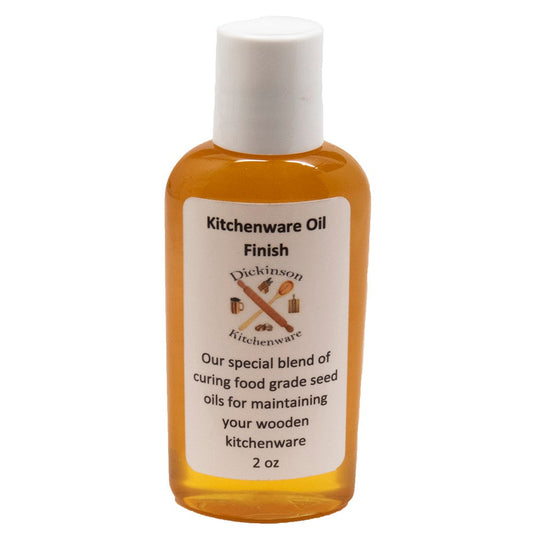Bottle of Kitchenware Oil Finish with a white label on a white background.