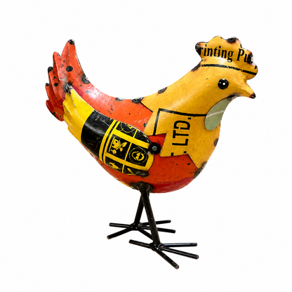 Decorative metal chicken sculpture with vintage label design on a white background