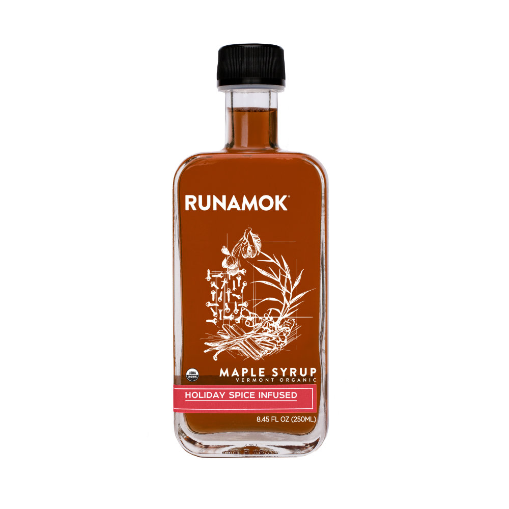 Bottle of Runamok Maple Syrup with a black cap on a white background