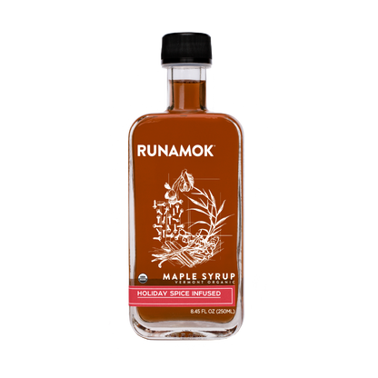 Bottle of Runamok Maple Syrup with a black cap on a white background