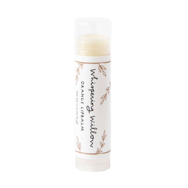 Lip balm with 'Whispering Willow' branding on a white background