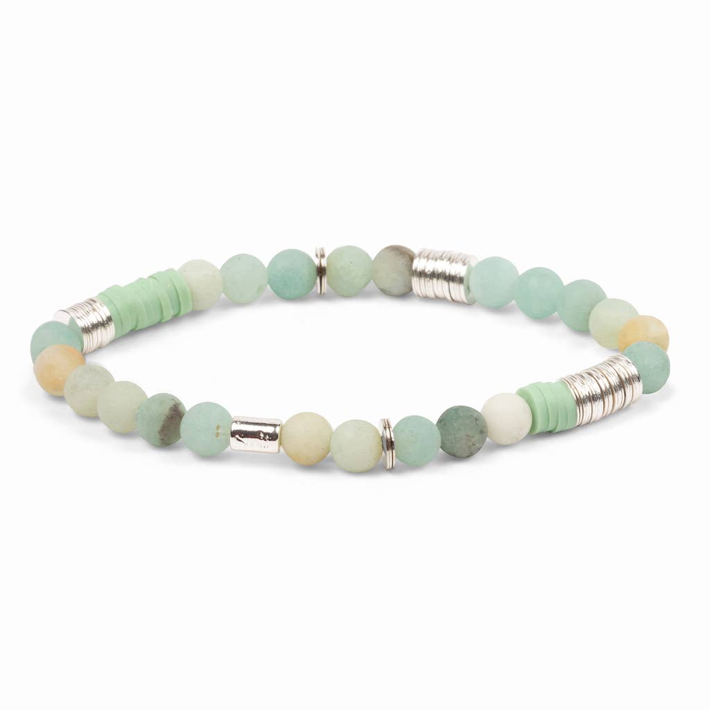 Bracelet with green beads and silver accents on a white background