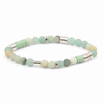 Bracelet with green beads and silver accents on a white background