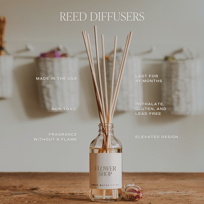 Reed diffuser with 'Flower Shop' label on a wooden surface, blurred background. Text describing product features. 