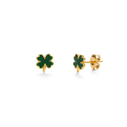 Gold and green four-leaf clover earrings on a white background