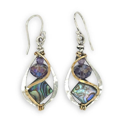 Pair of earrings with purple and green gemstones on a white background