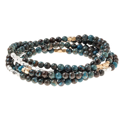 Convertible beaded necklace/wrap bracelet on a white background