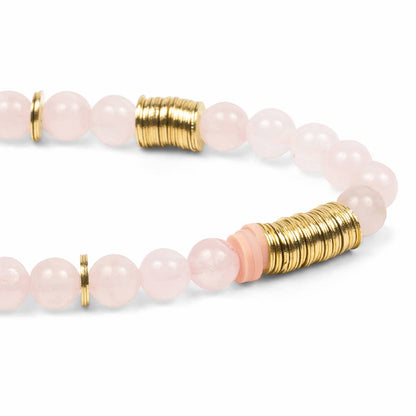 Bracelet with pink beads and gold accents on a white background