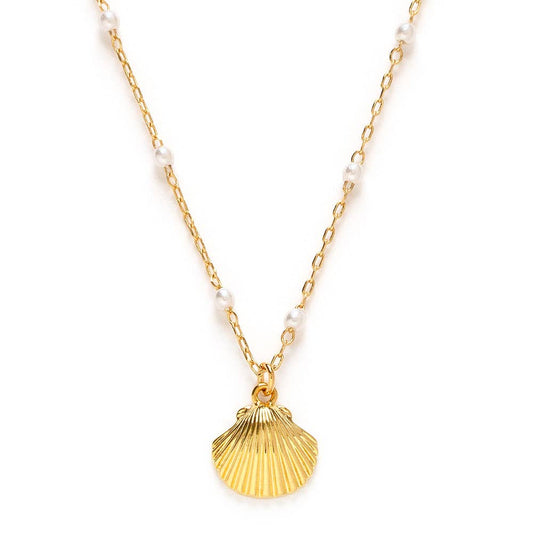 Gold shell pendant necklace with white pearls on a gold chain against a white background