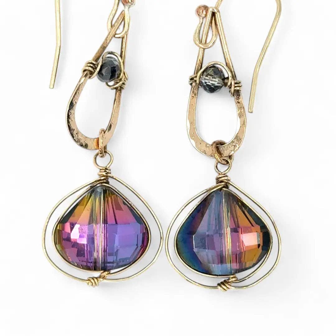 Multicolored teardrop earrings with gold accents on a white background