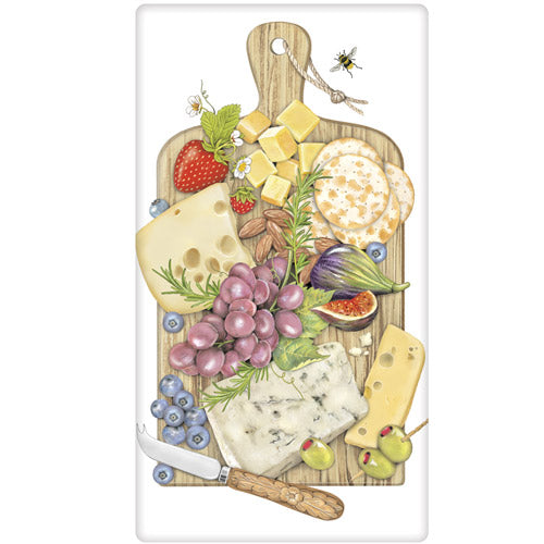 Tea towel with design of a decorative cutting board with assorted cheeses, fruits, and a knife on a white background.