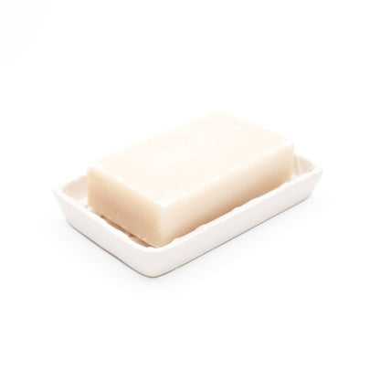 Bar of soap on a white dish with a white background